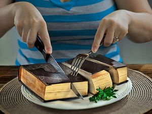 Book Sliced Up on Plate with Knife